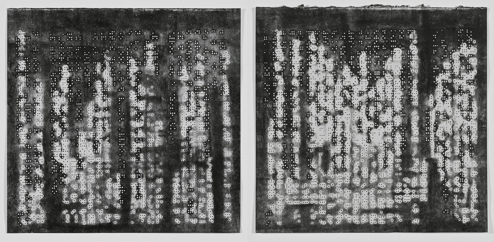 Two prints with a black background and blobs of white with tiny rectangular dots throughout like skyscraper windows at night from far away.