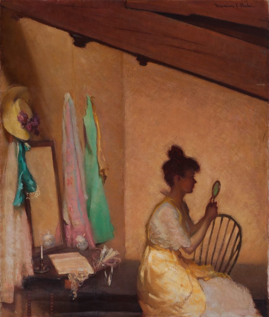 Painting of an attic space with an angled wood beam ceiling. The room is a deep tan, and there is a woman, seated facing right, looking at a small mirror. She is wearing a yellow dress and behind her on the opposite wall are dresses and a hat hanging around a rectangular mirror propped up on a table.
