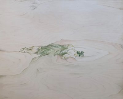 Painting on a light tan birch panel of a woman in a strapless dress or towel and hair in a bun laying on her stomach with her head looking down into a hole. The whole and some details of the figure utilize the tree rings seen in the panel.