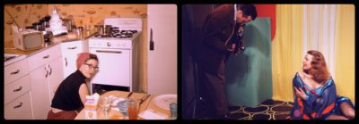 Two old colored photographs side by side. On the left is an old kitchen with white cabinets and stove with a woman crouched at the stove looking back at the photographer. On the right is a man in a brown suit taking a photograph of a woman in a blue and orange dress with low shoulders who is on the ground supported by her left arm looking up at the man taking the photograph.