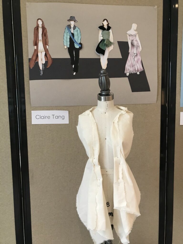 Photograph of a dress form with an outfit in linen and a drawing of a runway with various models wearing different outfits.