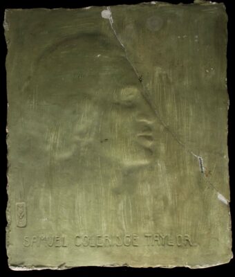 Green square plaster plaque of a man's face in profile to the right. Below are the words 'Samuel Coleridge Taylor'.
