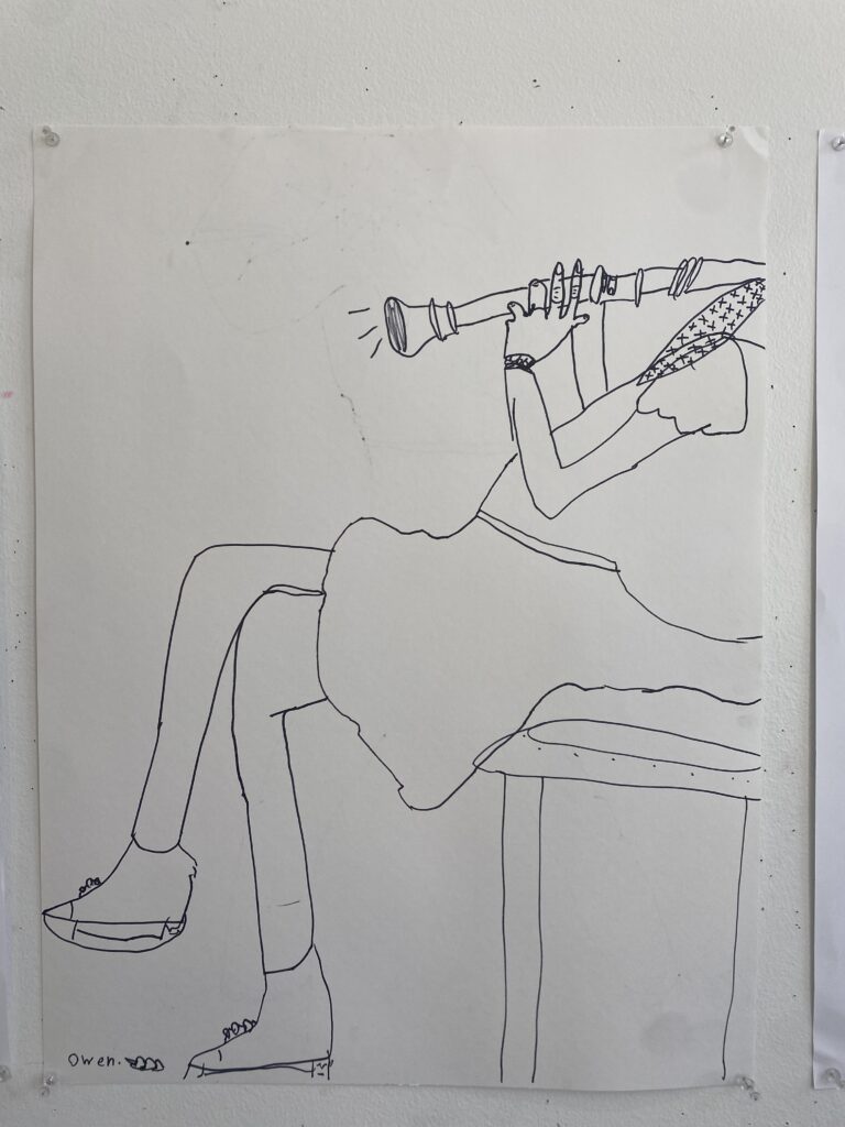 Black line drawing of a figure in a dress, seated with crossed legs. Their head is off of the paper, but they are holding up a recorder and playing.
