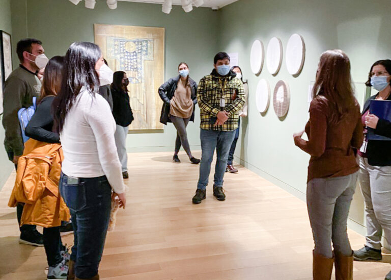 Photograph of a group tour in a museum gallery