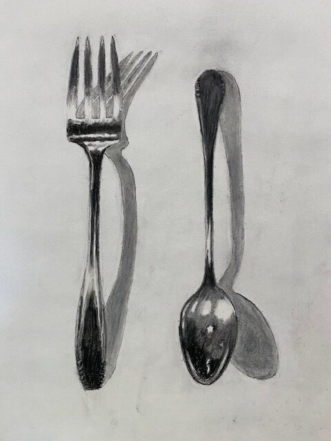 Drawing of a fork on the left and a spoon on the right.