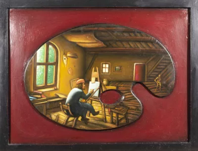 Painting in a black frame and red panel background with artists palette glue to the front. The palette is painted with a scene of an artist studio, all in wood and shades of brown, with a arched window on the left, the artist seated in the center at an easel painting, and a table, doorway, and small wooden figurine to the right.