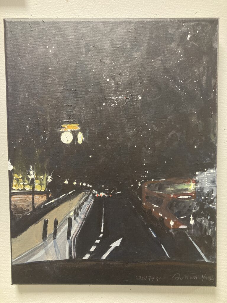 Photograph of a painting with an intense black sky. Across the foreground is a black roadway with a double decker red bus on the far right. On the left is a black tower with a glowing clock face.