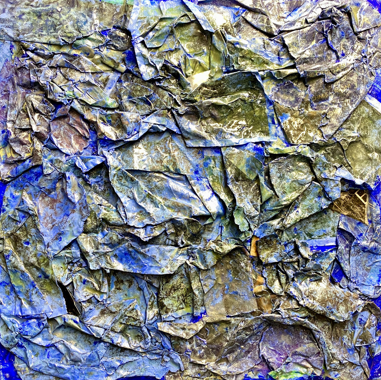 Textured artwork with folded bright blue fabric and sections of yellow, gold, and purple all throughout.